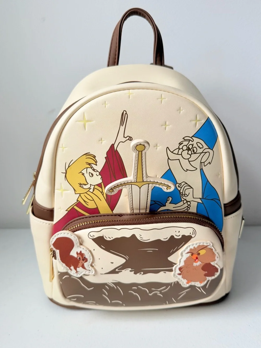 Loungefly Disney  The Sword in the Stone Mini Backpack Cream/Yellow